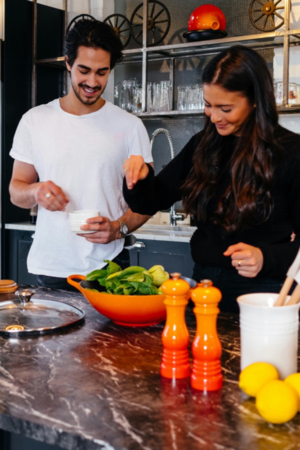 Couple cooking an affordable meal Couple cooking an affordable meal